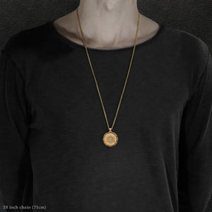 Model wearing 18K Yellow Gold Sewn Gold Metal Sun pendant and chain with endless loop necklace featuring 20 pointed gear by Caps Brothers